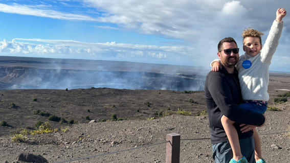 Harrison and his dad at the top of the volcano