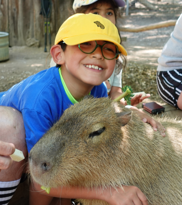 Wish kid Joshua with a capybara